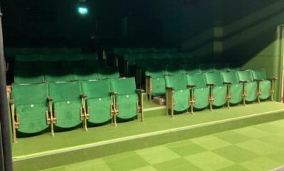 The new Phoenix Theatre refurbishment, featuring bright green carpet and seats in the main theatre area.