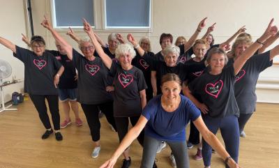 A group of ladies holding a dance pose