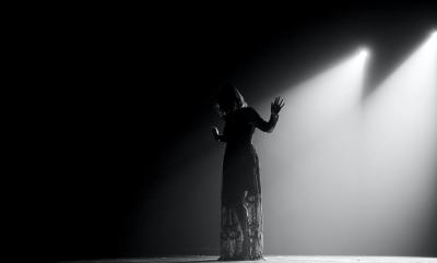 Silhouette of an actor on stage.