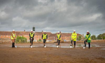 Workers break ground at The Shed building site.