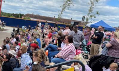 A crowd enjoying the Punch & Judy show.