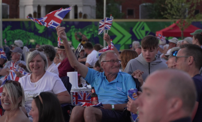 A Group Of People Waving Great British Flags