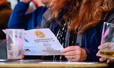 Phoenix Beer Fest 2022 Person Reading A Programme