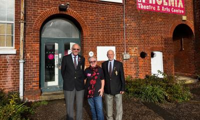 Two Royal British Legion Members and a Phoenix Arts Volunteers stood outside The Phoenix Theatre.