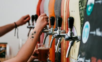 Beer stillages with pints being poured