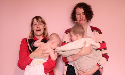 Two women holding babies