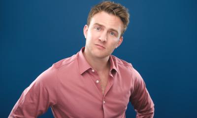 A man in a pink shirt