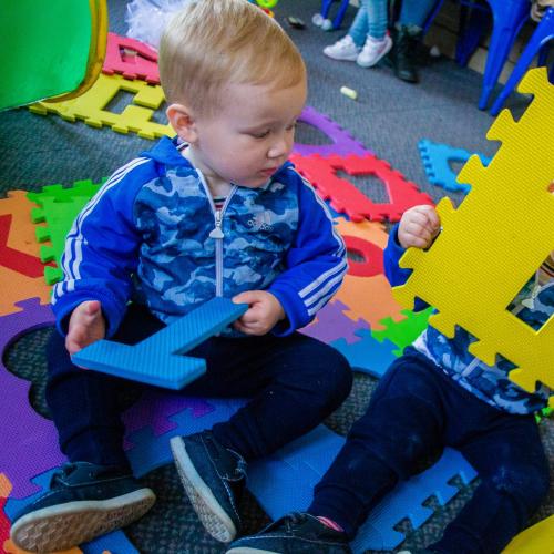 Two toddlers playing at Phoenix Tweedle Tots.